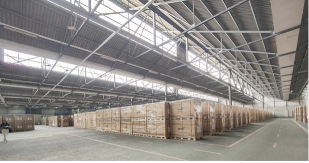 Warehouse interior with stacked wooden crates