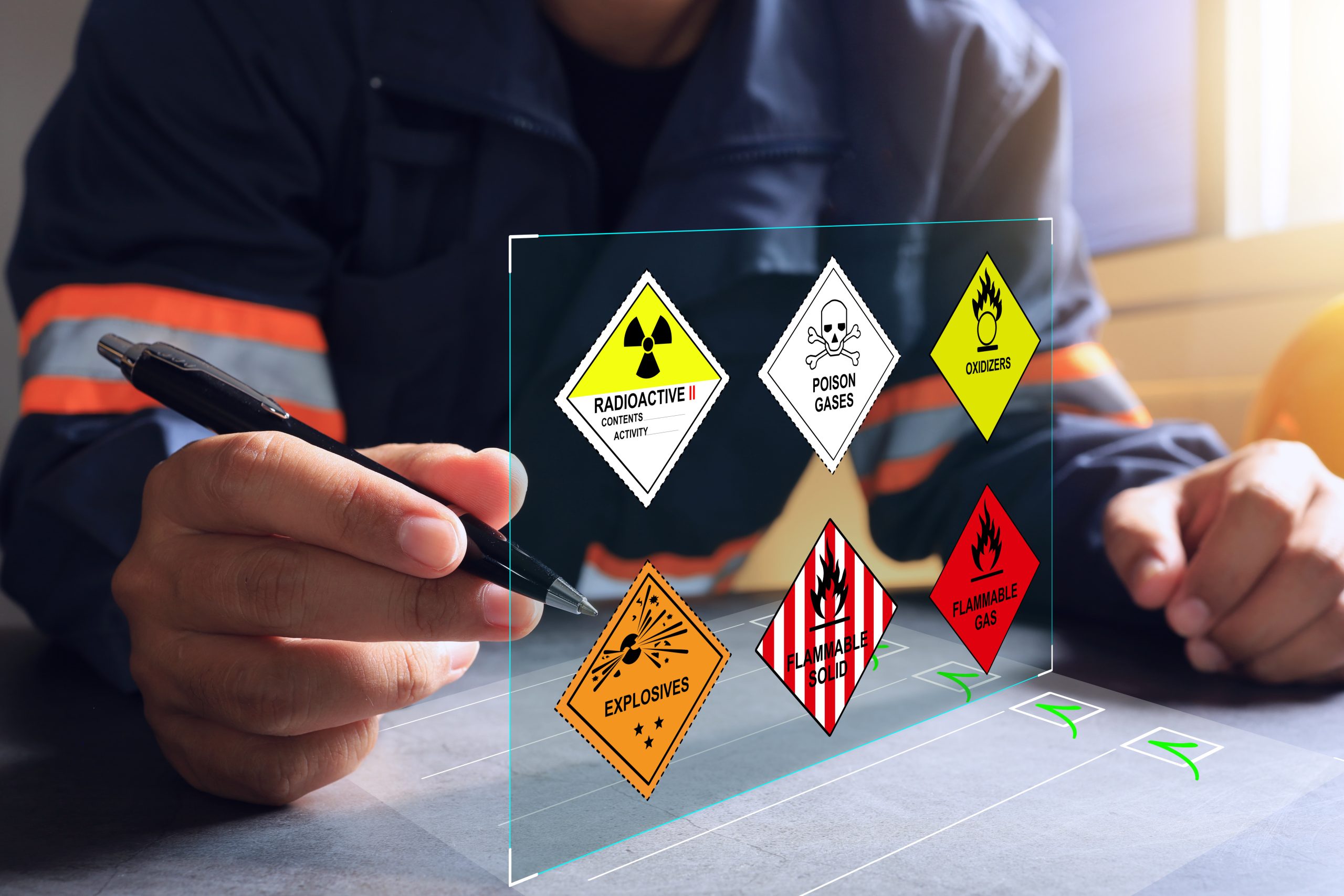 Person viewing a digital display of dangerous goods hazard labels