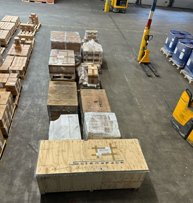 Crates and wrapped pallets prepared for outbound shipment