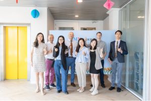 Group of people standing together in an office