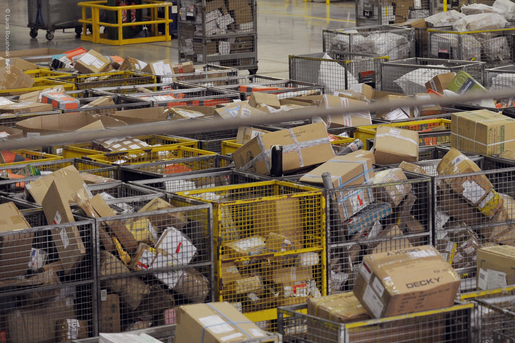 Parcels in sorting cages at a distribution facility